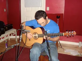 Anton recording in the studio with his guitar.