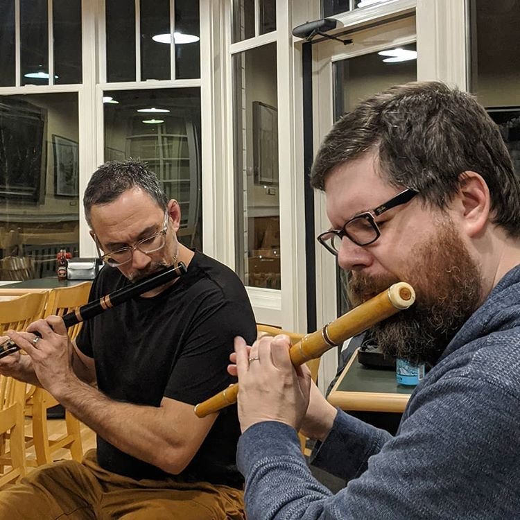 William and Anton playing irish flutes at Roche Harbor