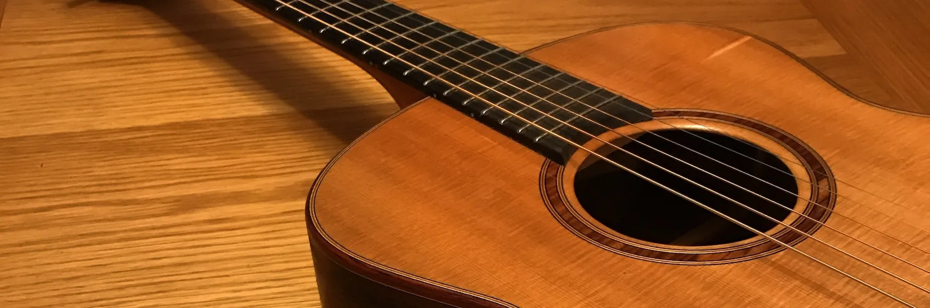 Acoustic guitar on a wooden table
